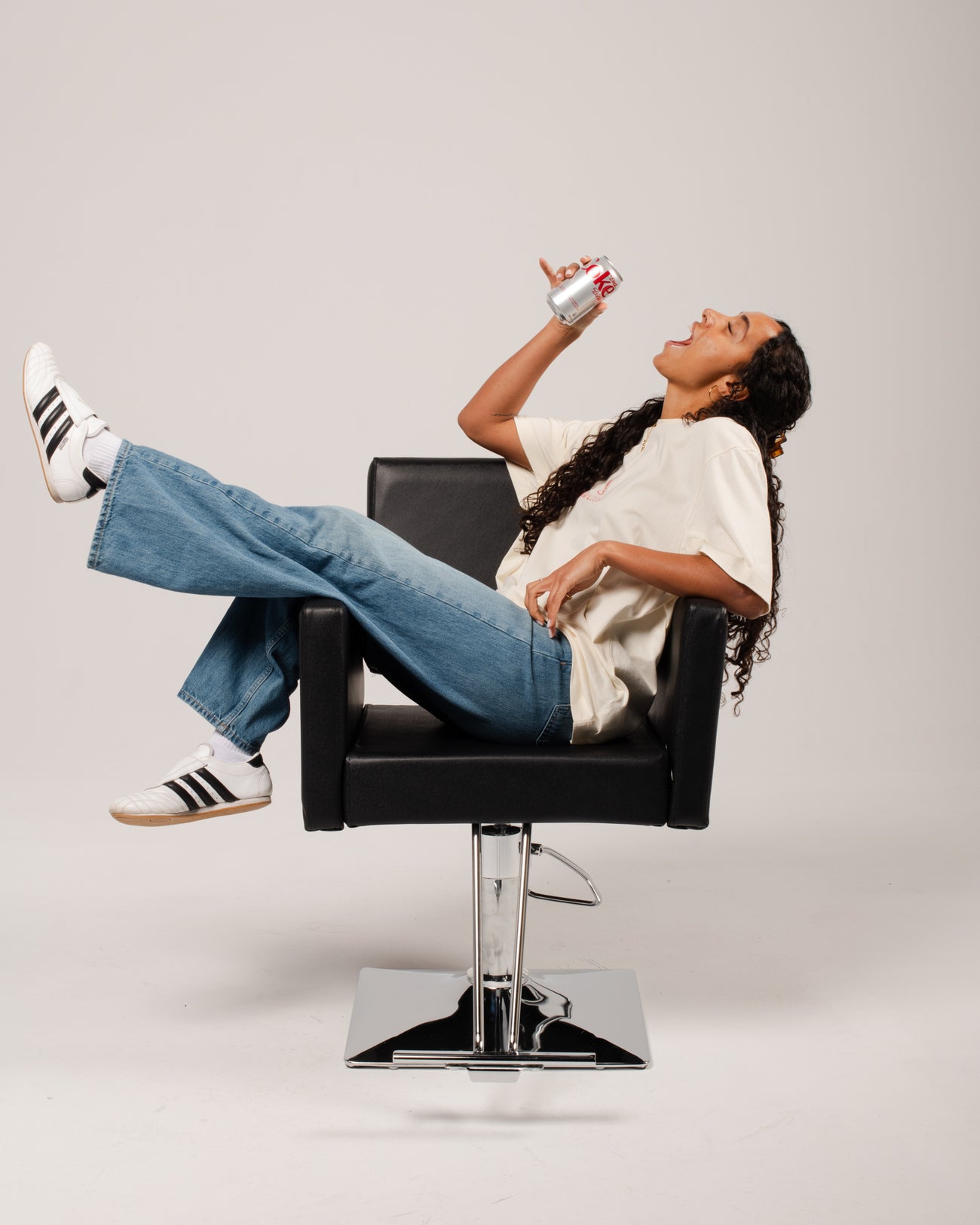 Stylist and client in a salon with Diet Coke® by Framar tools