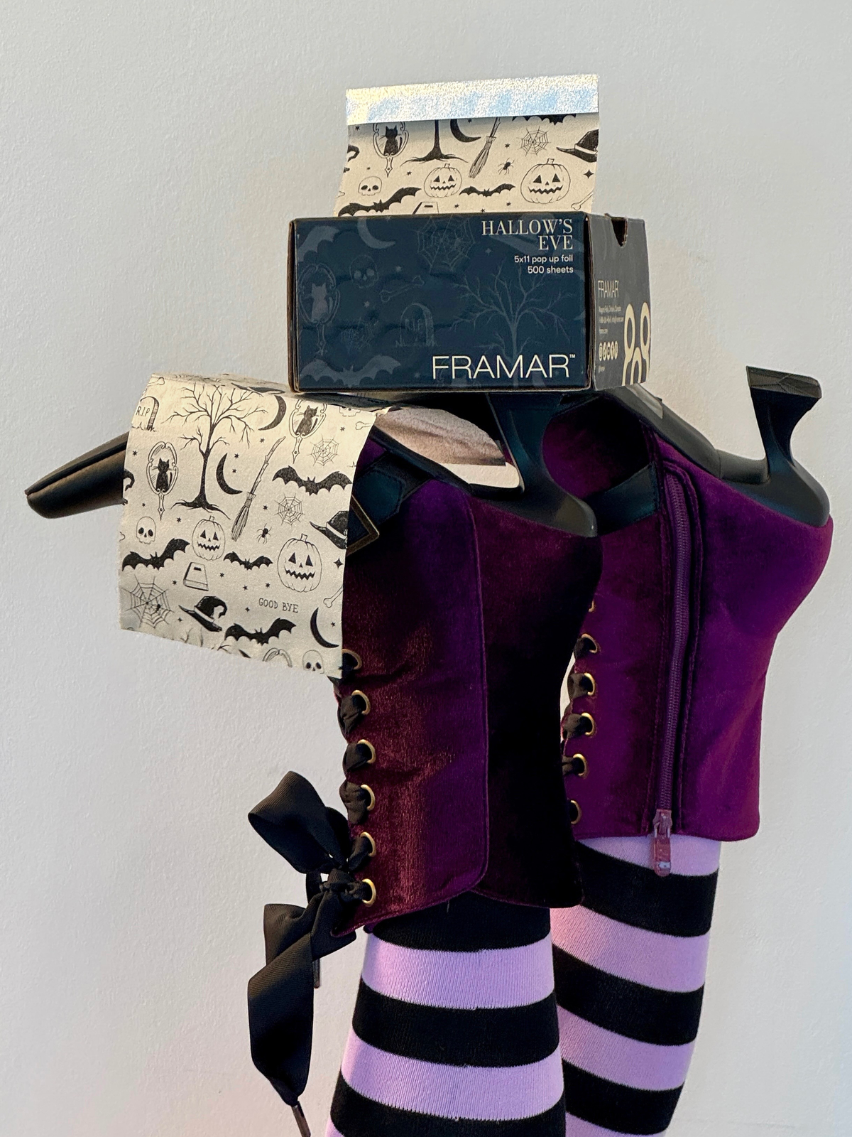 The Framar Hallow’s Eve foil collection styled on a dark table by candlelight