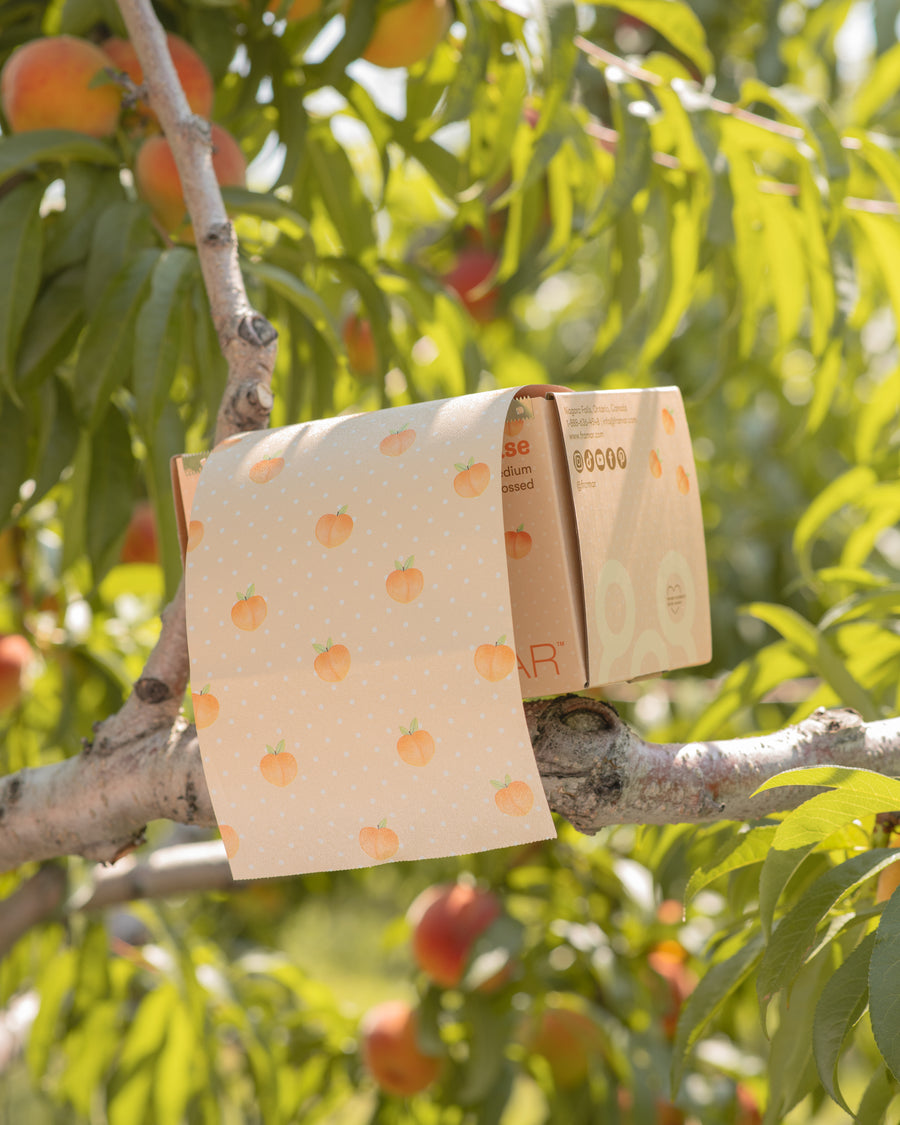 Peach patterned embossed foil roll in its dispensing box